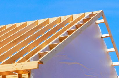 Construction framework for a new framed building with rafters roof beams is currently being