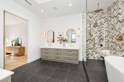 Modern bathroom with stylish decor and herringbone tile.